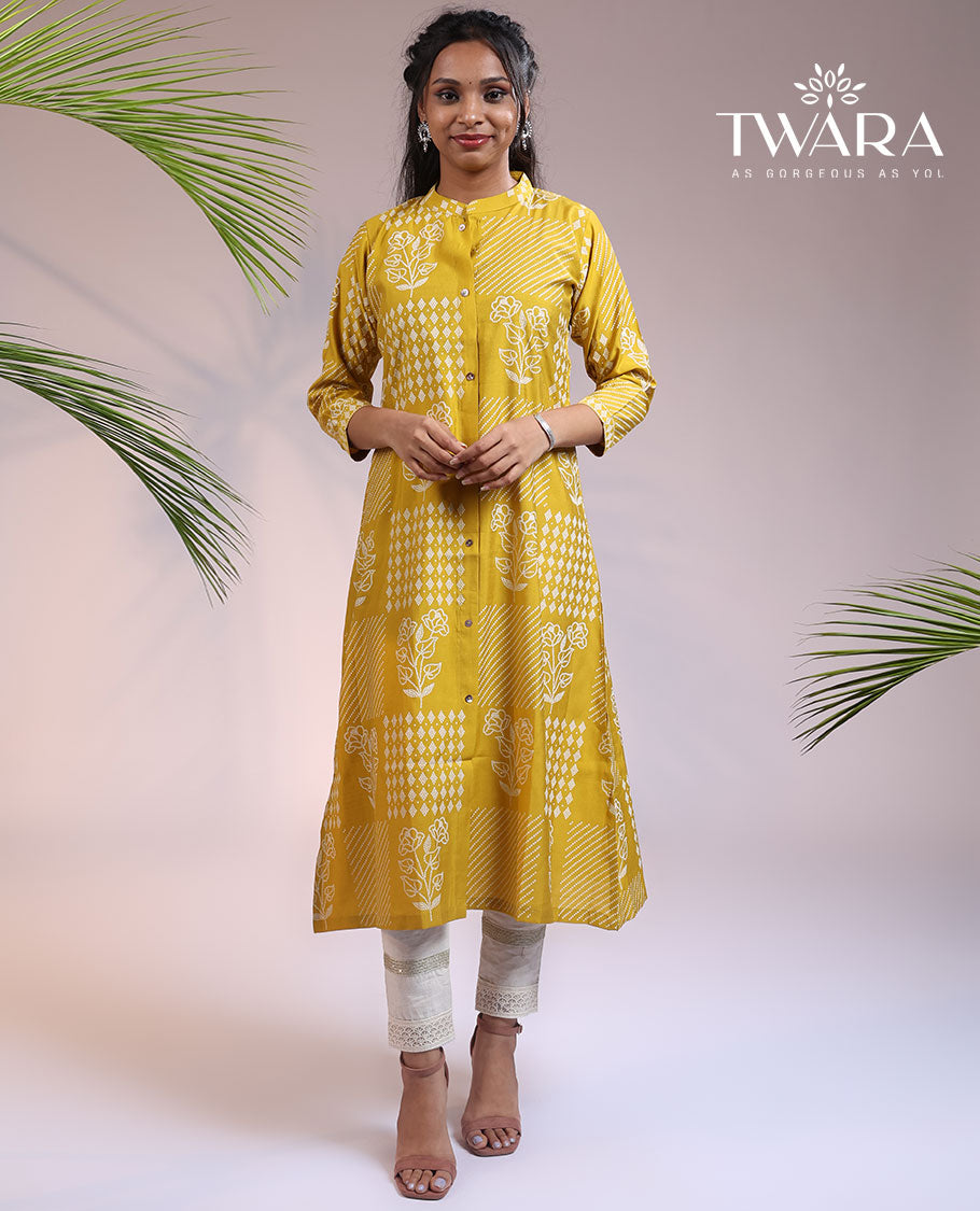 Twara yellow floral motifs with bandhani dots printed 3/4th sleeve & Chinese collar muslin straight-cut below-knee kurti