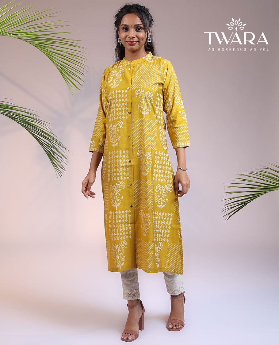 Twara yellow floral motifs with bandhani dots printed 3/4th sleeve & Chinese collar muslin straight-cut below-knee kurti