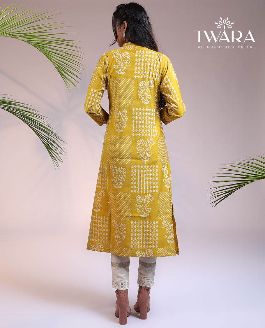 Twara yellow floral motifs with bandhani dots printed 3/4th sleeve & Chinese collar muslin straight-cut below-knee kurti