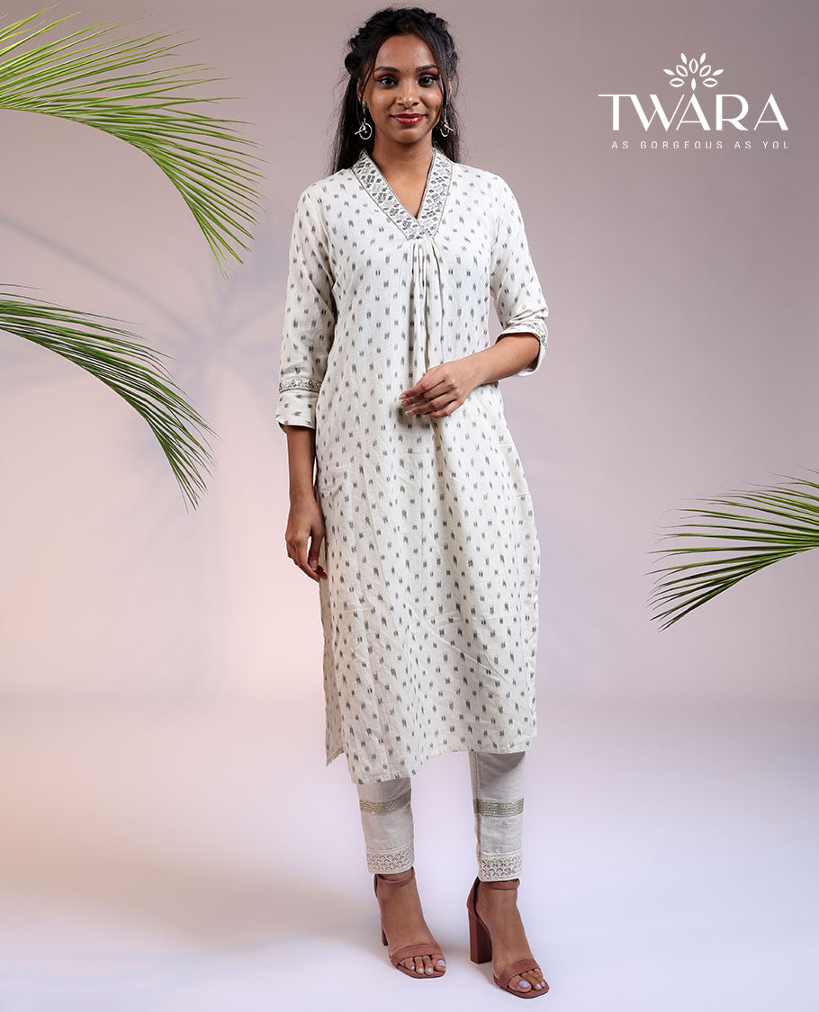 Twara cream unique buttas 3/4th sleeve & V-neck cotton straight-cut below-knee kurti