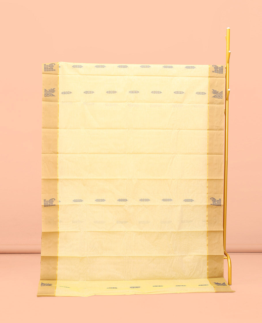 Yellow Kanchi Cotton Saree, Subtly Sparkled with Buttas All Over Its Body, Complemented by Contrast Border, Pallu of Floral Designs, and Paired with a Matching Blouse