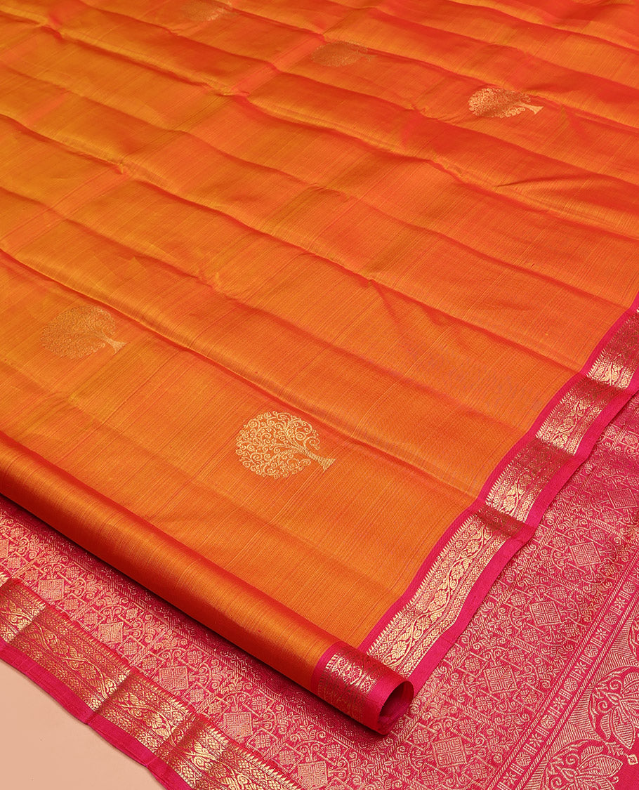 Orange Kanchipuram Silk Saree, Spotlighted with Tree Zari Buttas All Over Its Body, Complemented by a Contrast Border of Rekku, Cross Kamalam, and Kodi Visiry Designs, Intricately Designed Pallu, and Paired with a Contrast Blouse