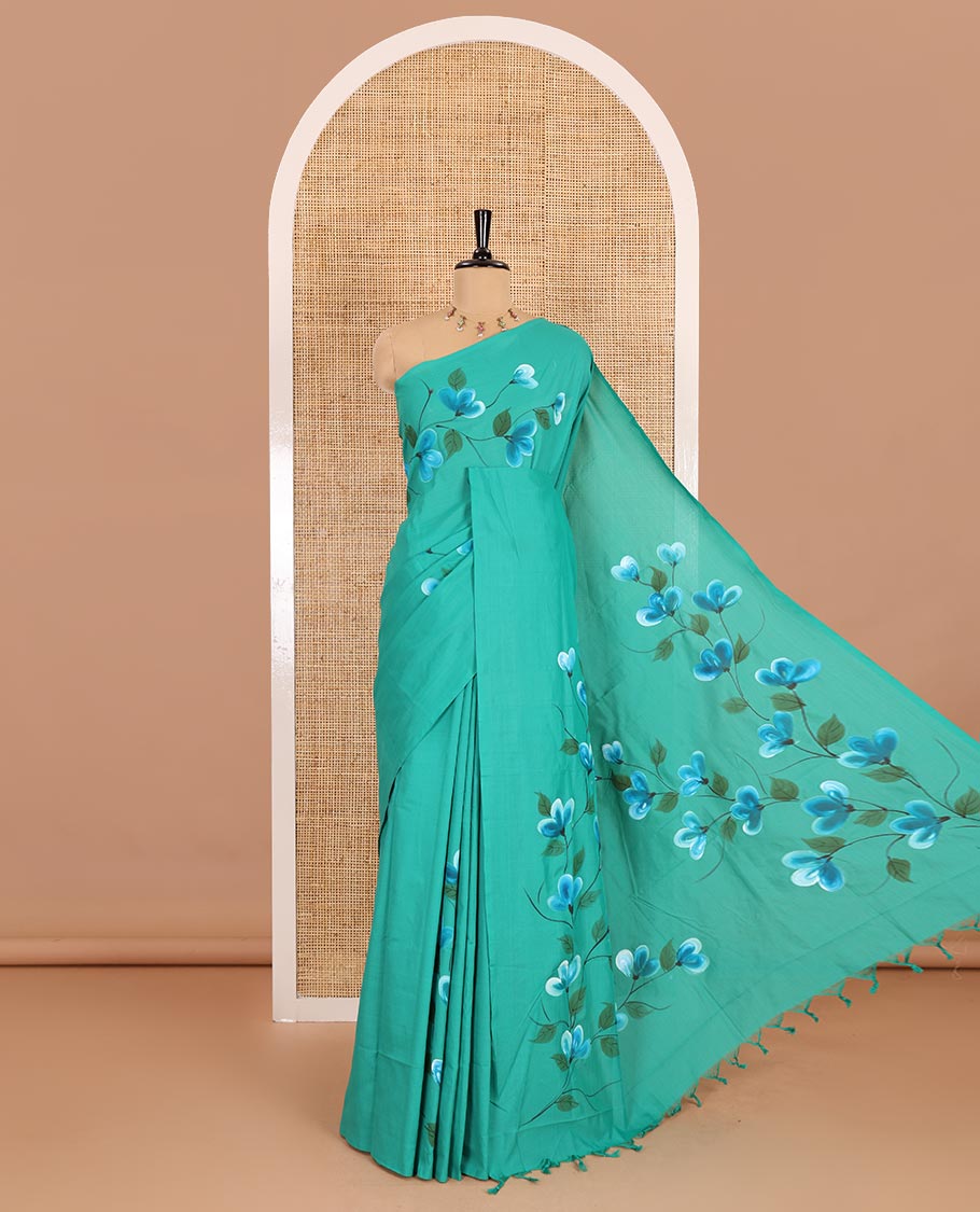 Borderless peacock green floral vine hand painting style placement printed South cotton saree and a matching floral printed blouse