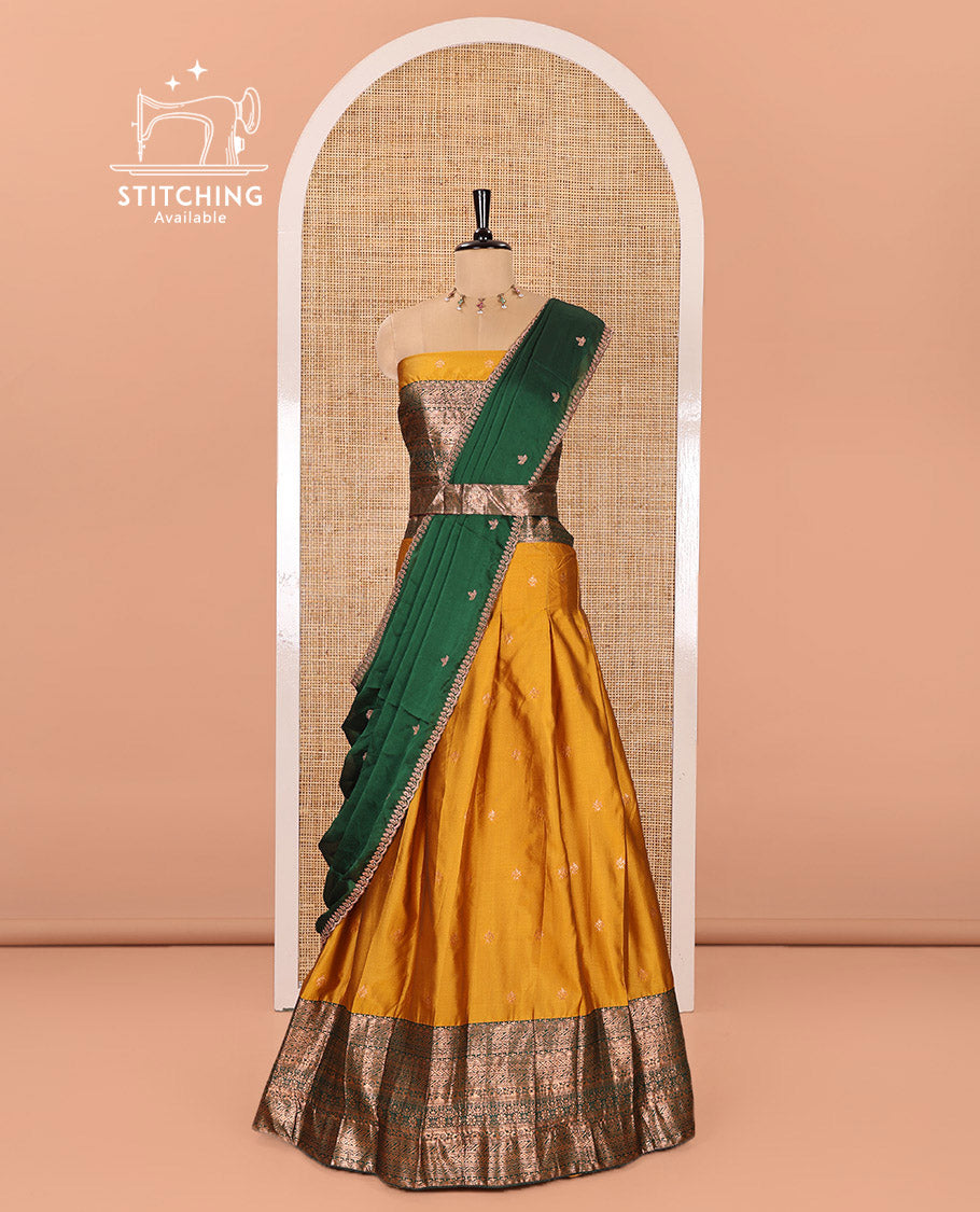 Yellow and Green Semi-Banarasi Half-Saree Beautifully Bedecked with Zari Buttas on Its Skirt, Complemented by a Contrast Traditional Zari Design Border, Paired with a Matching Blouse, and a Satin Georgette Embroidered Scallop Dhavani