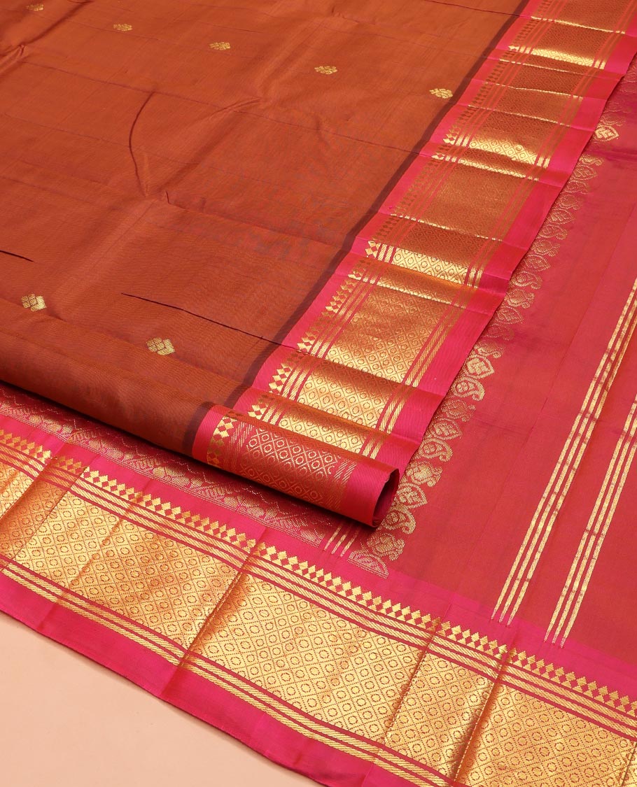 Brown Kanchipuram Silk Saree, Elevated with Zari Buttas on Its Body, Complemented by a Contrast One-Sided Border of Panner Sombu, Banaras, and Mayil Kann Designs, Pallu Features Floral Creeper Designs, and Comes Without a Blouse