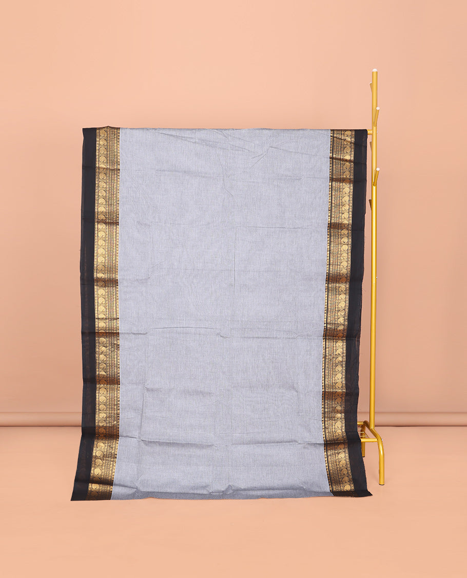 Grey Plain Chettinad Cotton Saree, Complemented by a Contrast Traditional Zari Design Woven Kal Eragina Border, Pallu of Stripes, and Paired with a Matching Blouse