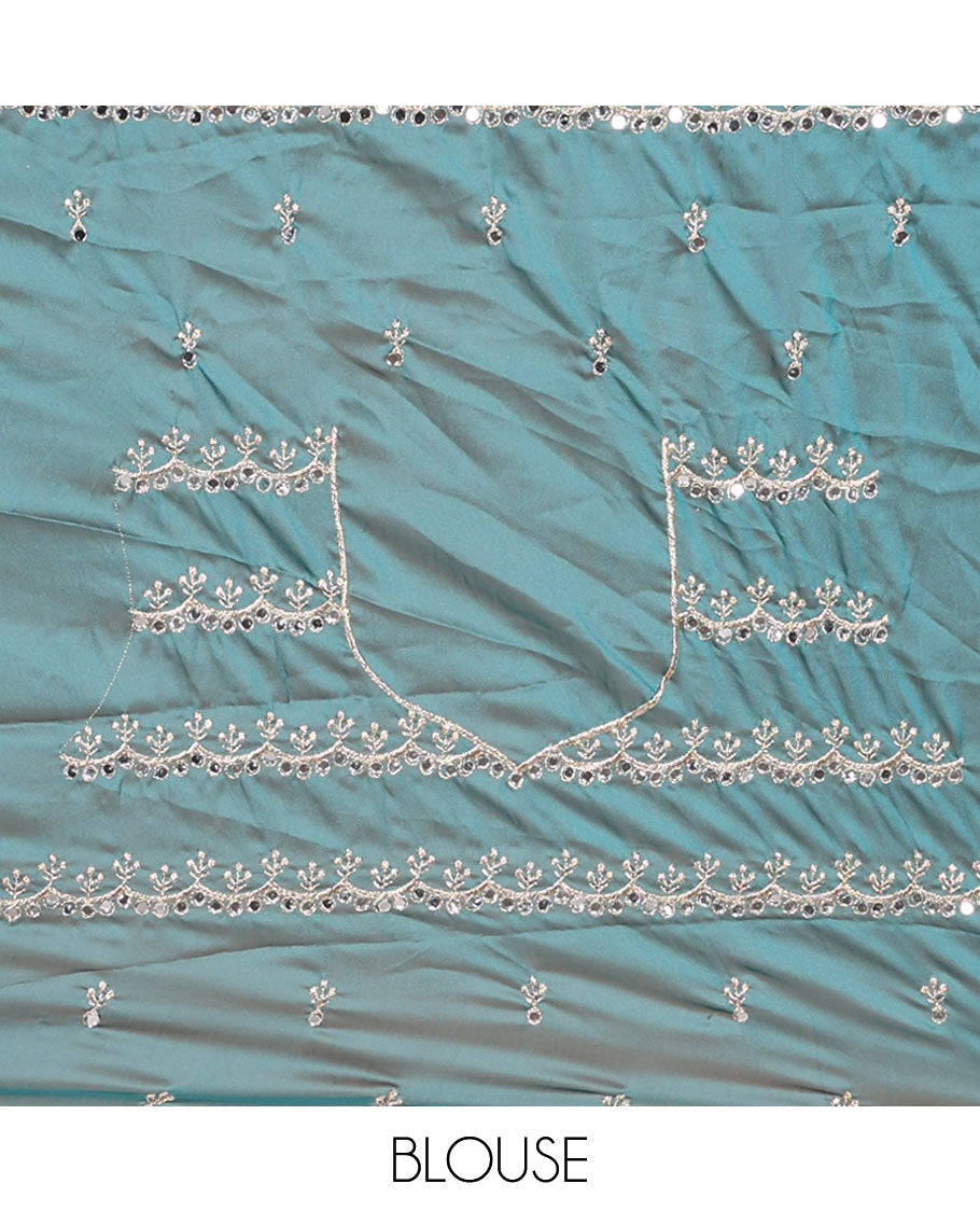 Blue floral motifs embroidered rangoli chiffon saree with mirror work border, embroidered pallu, and a contrast intricate scallop design embroidered blouse