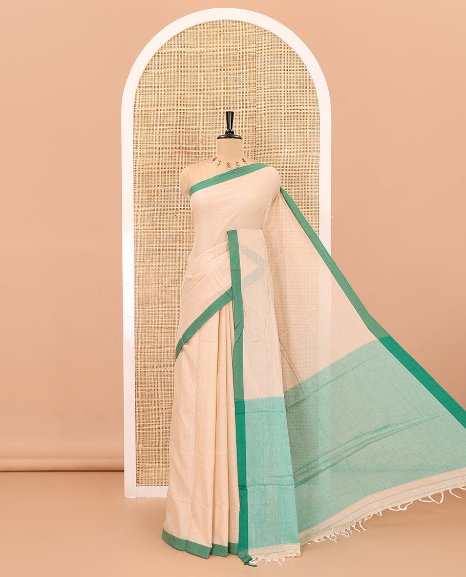 Cream-green plain mercerised cotton saree,contrast plain border, striped pallu, and a contrast plain blouse