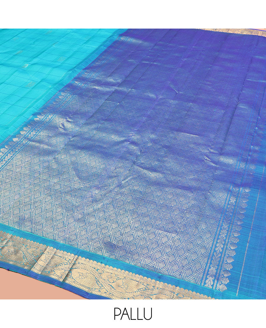 Blue Kanchipuram Silk Saree, Sparsely Sparkled with Mayil Butta Enclosed Checked All Over Its Body, Complemented by a Contrast Traditional Zari Design Border, Pallu of Jaal Designs, and Paired with a Contrast Blouse