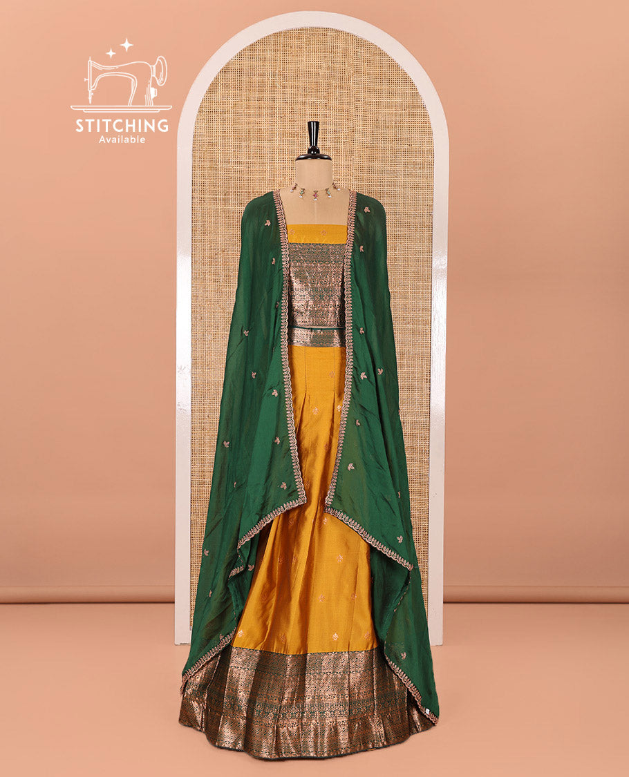 Yellow and Green Semi-Banarasi Half-Saree Beautifully Bedecked with Zari Buttas on Its Skirt, Complemented by a Contrast Traditional Zari Design Border, Paired with a Matching Blouse, and a Satin Georgette Embroidered Scallop Dhavani