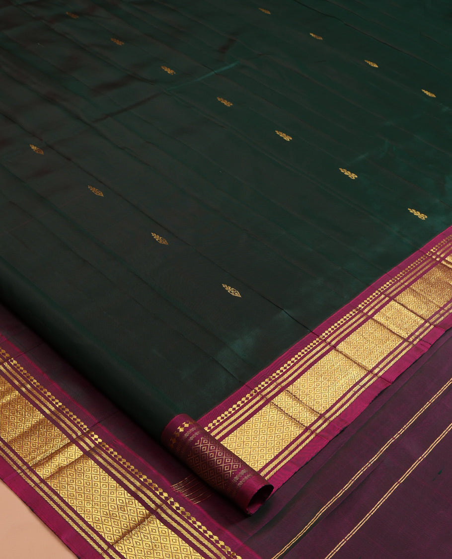 Green Kanchipuram Silk Saree, Woven with Zari Buttas, a Contrast One-sided Border of Panner Sombu, Banaras, and Mayil Kann Designs, Pallu of Zari Designs, and No Blouse