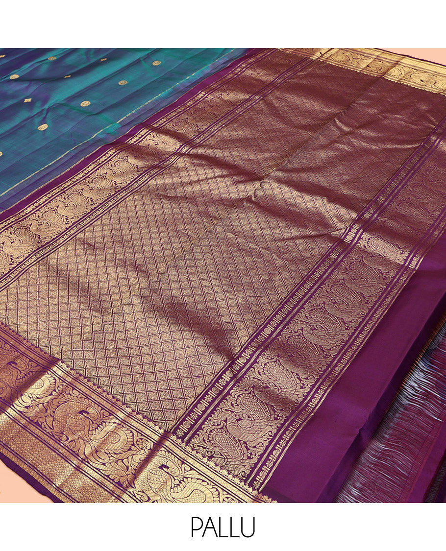 Blue Kanchipuram Silk Saree, Features Zari Buttas All Over Its Body, Complemented by a Contrast Border of Mayil Kann, Mayil, and Jaal Designs, Grand Jaal Pallu, and Paired with a Contrast Blouse