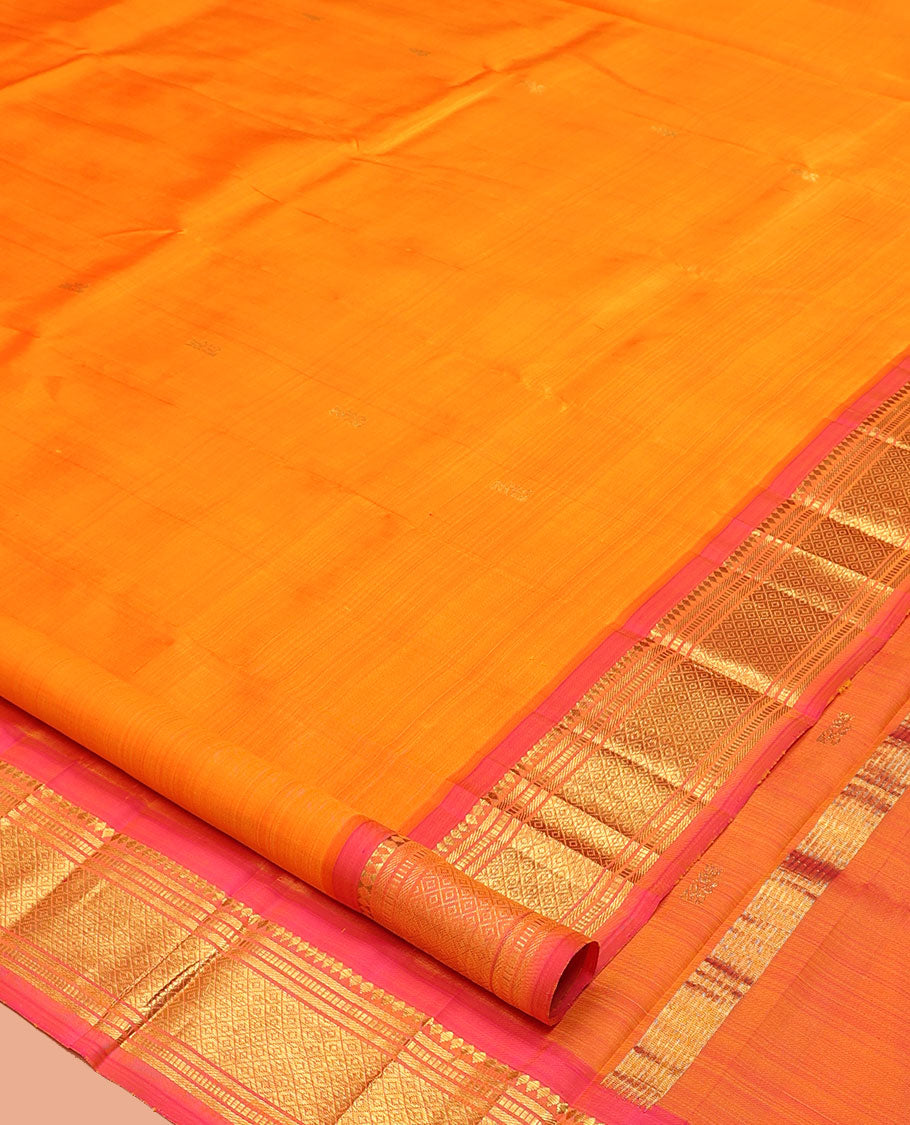 Orange Kanchipuram Silk Saree, Woven with Zari Buttas, a Contrast One-Sided Border of Banaras, Muthu, and Mayil Kann Designs, a Zari Design Pallu, and No Blouse