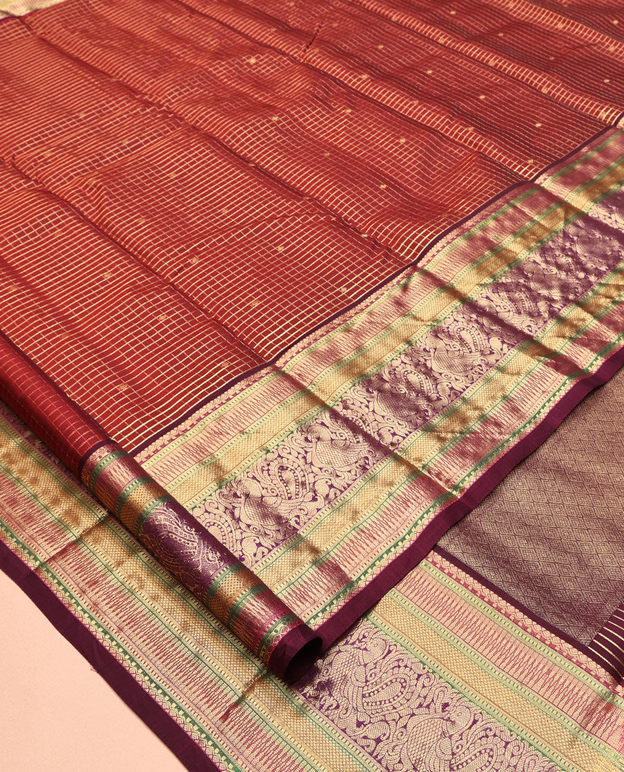 Maroon Vasundhara Lite Silk Mix Saree, Adorned with Zari Butta Enclosed Checks, a Zari Border of Rekku, Kuyil Kann, and Mayil Designs, Grand Pallu, and a Matching Blouse
