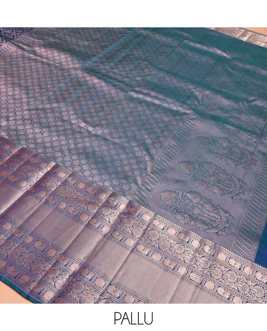Blue Kanchipuram Wedding Silk Saree, Detailed with Jacquard Design on Its Body, Highlighted by Zari Border of Thilakam, Kodi Visiry, Mayil, and Poun Designs, Grand Pallu, and Paired with a Matching Blouse