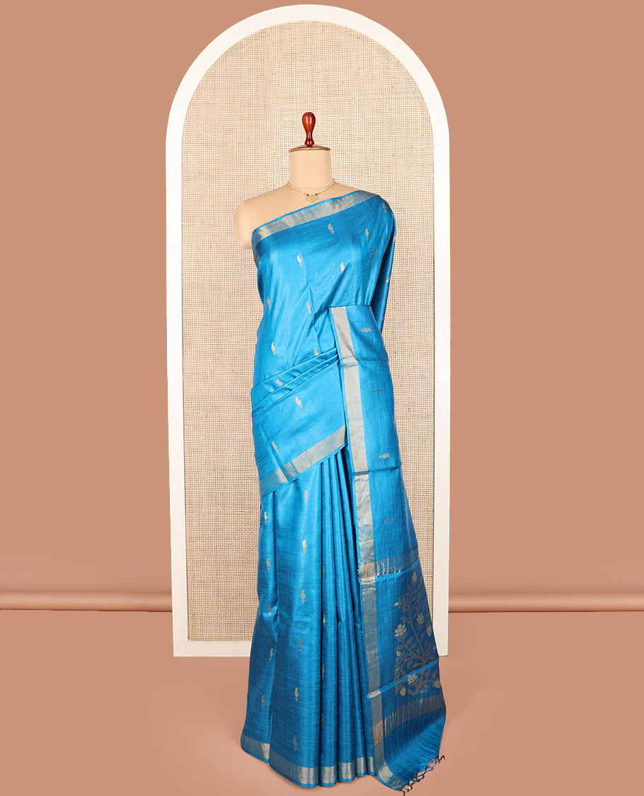 Blue paisley buttas tussar saree, zari border, and pallu of floral designs