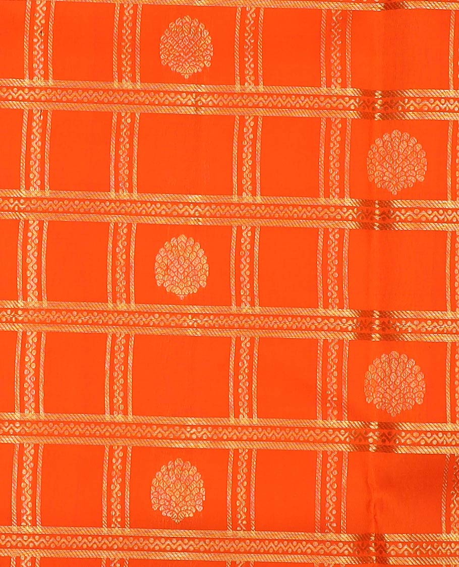 Orange pure-silk half-saree, zari buttas and checked skirt, contrast kodi visiry border, zari design blouse, and a intricate zari woven dhavani
