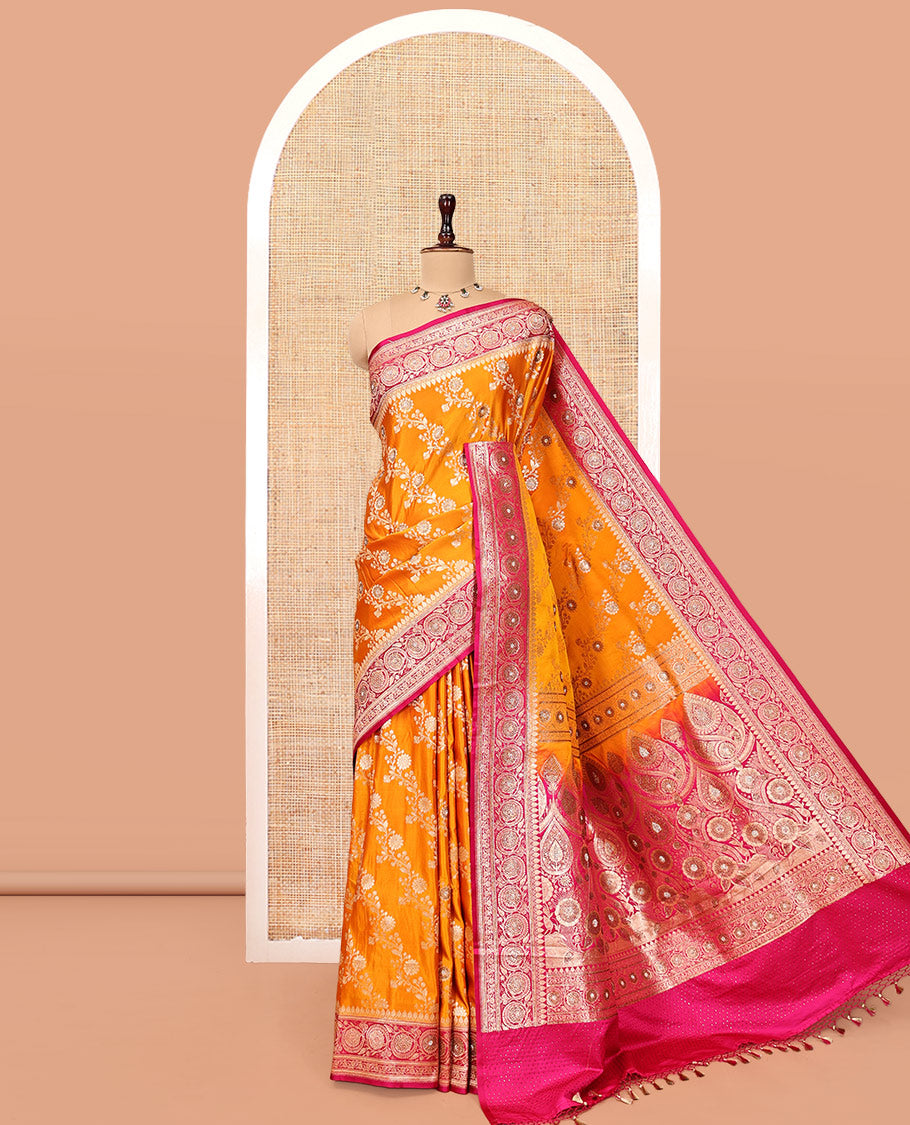 Orange Banarasi Satin Saree, Mesmerized with Floral Jaal Jacquard, a Contrast Floral Creeper Border, Intricate Stonework Pallu, and a Contrast Blouse