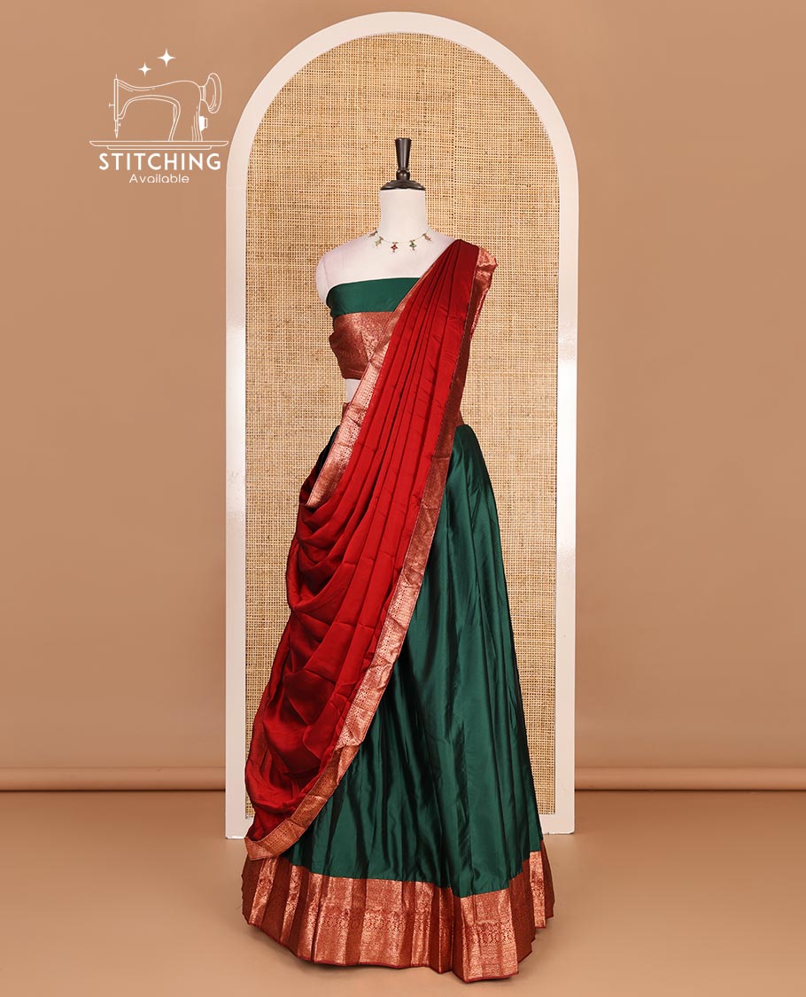 Dark green taffeta silk half saree, plain with contrast red traditional zari border, matching zari blouse, and contrast plain zari border dhavani