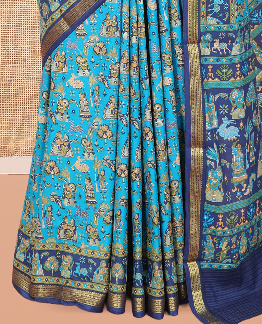 Blue Printed Silk Saree, Adorned with a Village-Themed Print, a Contrast Traditional Zari Border, Striped Pallu, and a Contrast Blouse