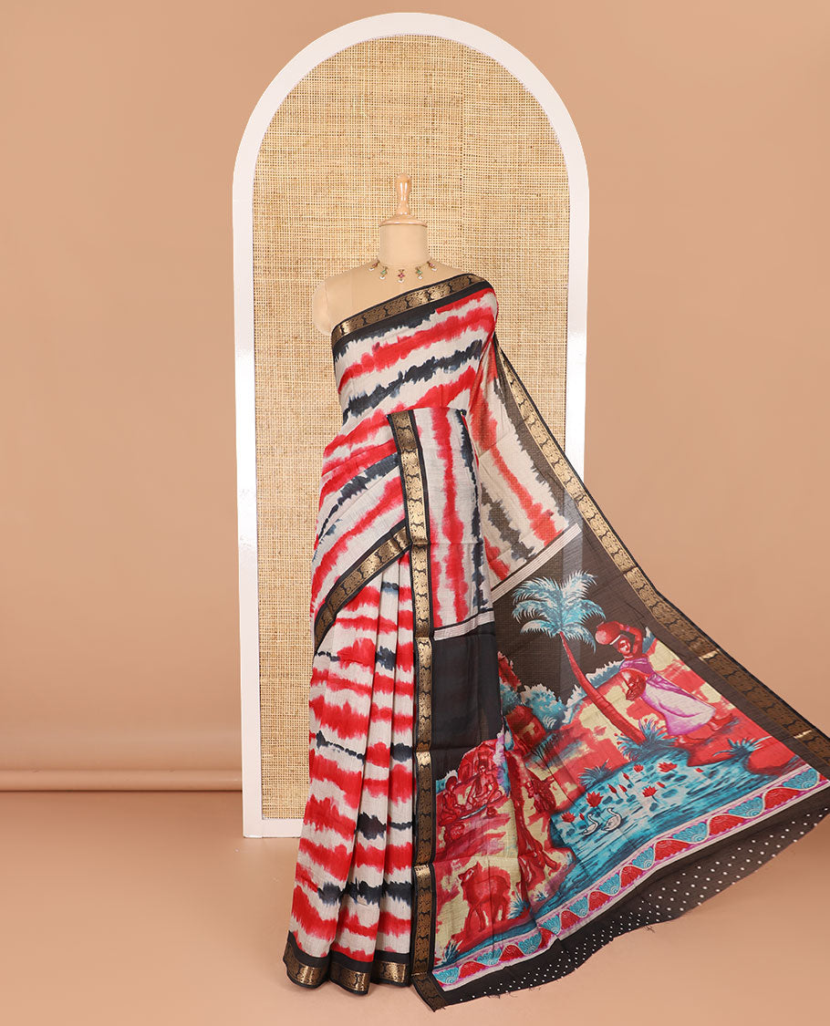Red shibori printed muslin cotton saree, contrast peacock zari border, village scenery printed pallu, and a contrast polka dotted zari border blouse