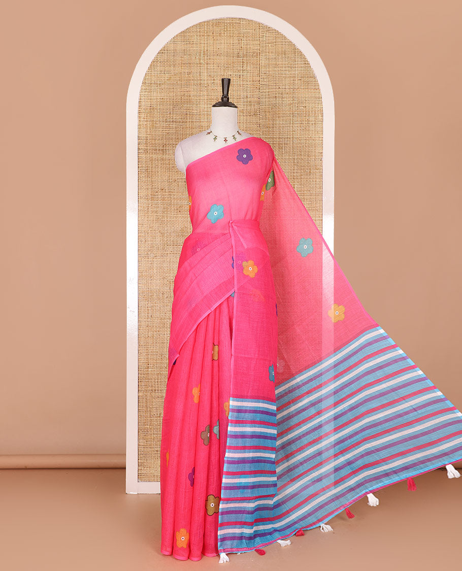 Borderless pink colorful five-petal flower motifs printed linen cotton saree, multi-color striped pallu, and contrast printed blouse