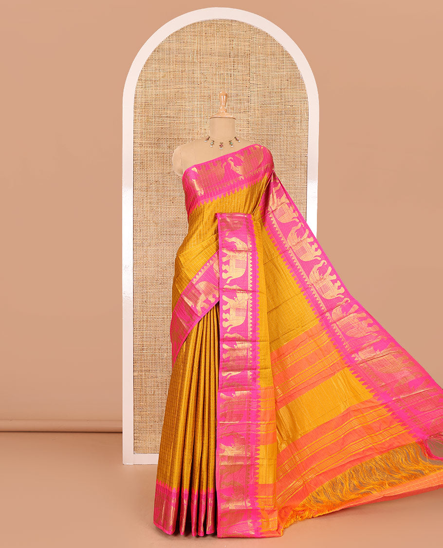Mustard zari checked semi-taffeta saree, contrast satin temple border of elephant motifs, striped pallu, and a contrast striped blouse