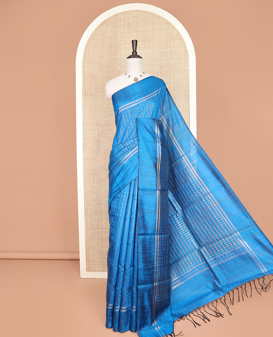 Blue Dupion Silk Saree, Beautified with Stripes All Over Its Body, Zari-Striped Border, Pallu Steeped with Dobby-Style Buttas, and Paired with a Matching Blouse