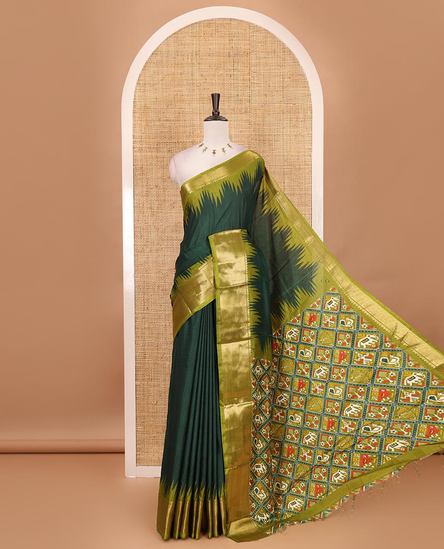 Green plain dola-tussar saree, contrast temple zari border, patola animal motifs enclosed jaal printed pallu & patola printed blouse