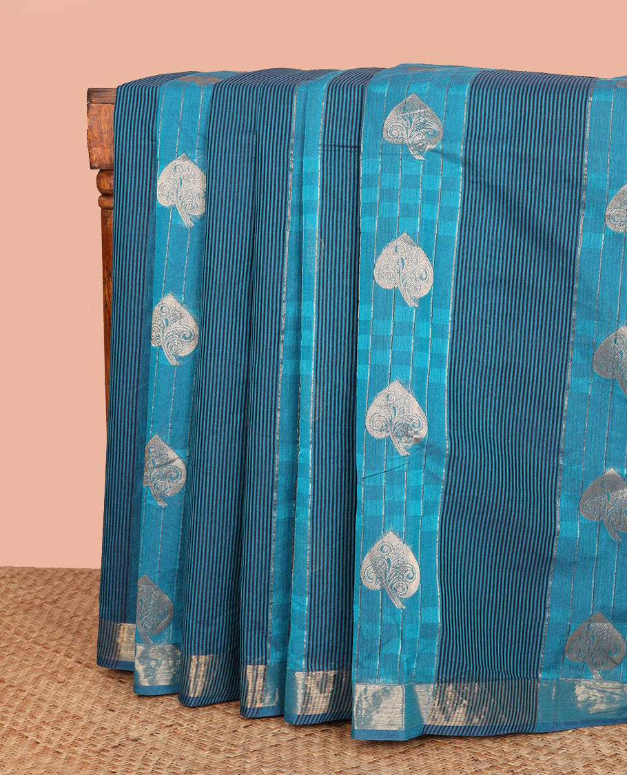 Blue Coimbatore Cotton Saree Delicately Designed with Stripes, Checks, and Buttas All Over Its Body, Subtly Zari Border, Sparsely Woven Pallu of Floral-Leaf Designs, and Paired with a Matching Blouse