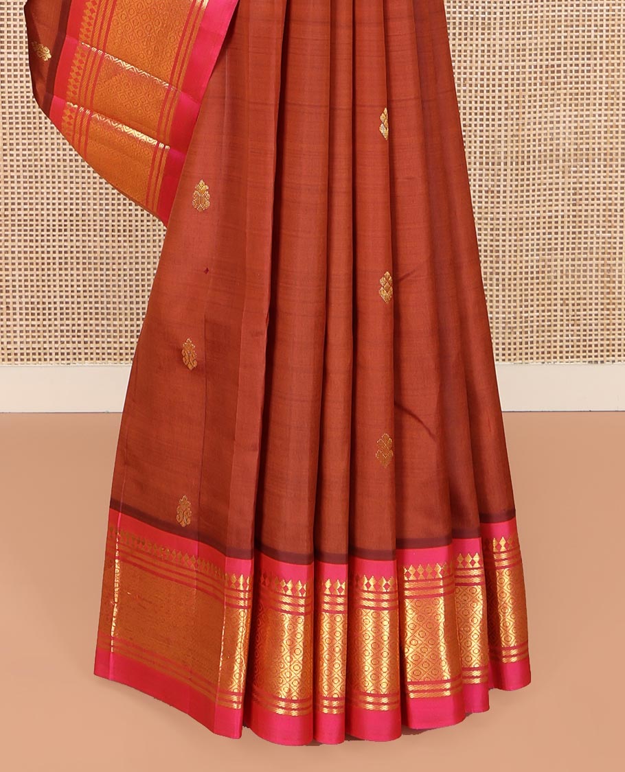 Brown Kanchipuram Silk Saree, Elevated with Zari Buttas on Its Body, Complemented by a Contrast One-Sided Border of Panner Sombu, Banaras, and Mayil Kann Designs, Pallu Features Floral Creeper Designs, and Comes Without a Blouse