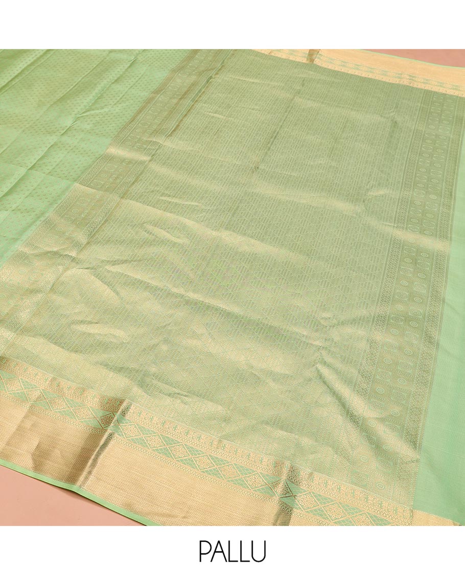 Green Vasundhara Silk Saree, Steeped with Zari Buttas on Its Body, Highlighted by a Zari Border of Traditional Designs, Richly Woven Jaal Pallu, and Paired with a Matching Blouse