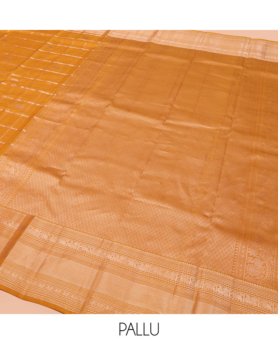 Yellow Vasundhara Silk Saree, Enriched with Zari Butta Enclosed Checked Design All Over Its Body, Highlighted by Zari Border of Thilakam Mokku, Muthu, Mayil, Yaanai, and Mayil Kann Designs, Grand Jaal Pallu, and Paired with a Matching Blouse