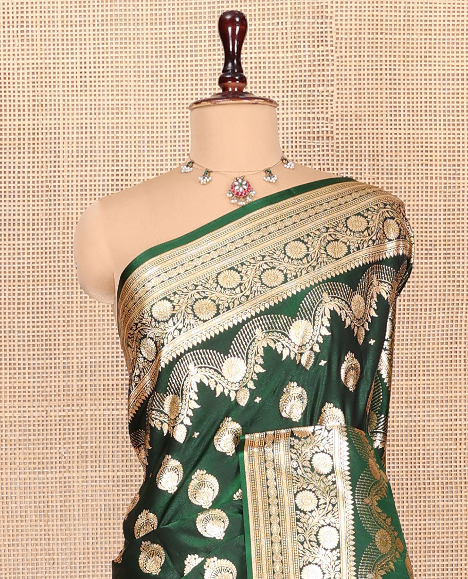 Green Banarasi Nylon Saree, Richly Detailed with Zari Buttas, Highlighted by a Traditional Zari Border, Intricate Pallu, and a Matching Blouse