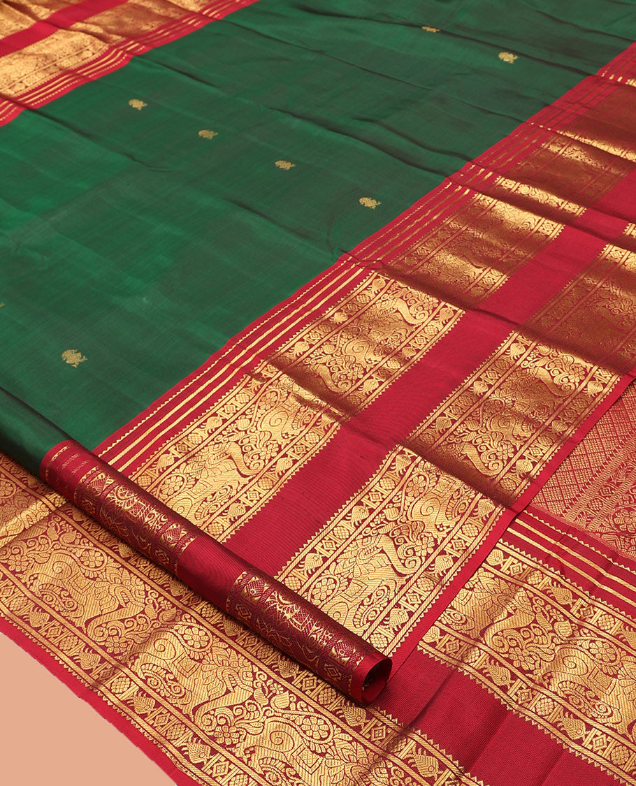 Green Kanchipuram Silk Saree, Adorned with Zari Buttas, Complemented by a Contrast Rettai Pettu Border of Rekku, Meen, and Yaali, Grand Jaal Pallu, and Contrast Blouse