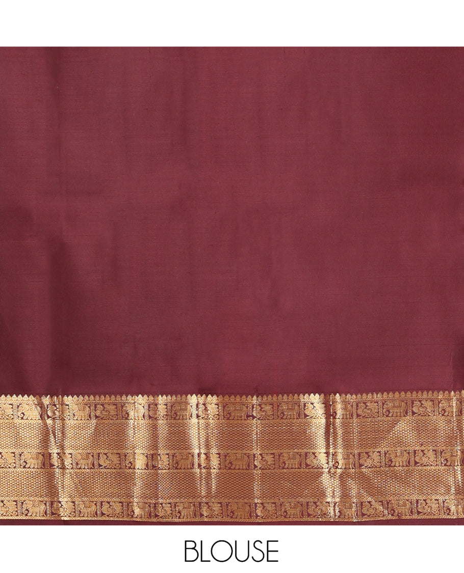 Brown Kanchipuram Silk Saree, Adorned with Zari Buttas, a Zari Border of Iruthalai Pakshi, Thilakam, Kathir, Mayil, Yaanai, and Mayil Kann Designs, Jaal Pallu, and a Matching Blouse