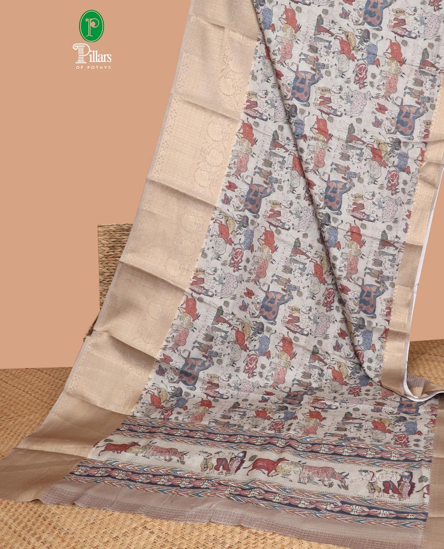 Cream all-over animal, fifure motif digtal printed with contrast gold zari jacquard border & printed rich pallu along with contrast plain blouse