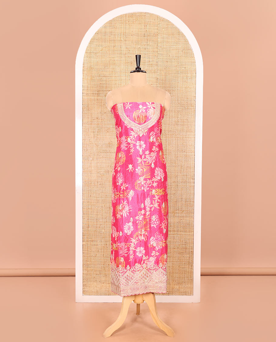 Rani Pink Material Chudidar Set Adorned with Floral-Geometric Printed with Neck Embroidered Chinon Top, Subtly Made Plain Santoon Bottom, and a Chinon Dupatta Featuring Printed Border, and Glitter Dots
