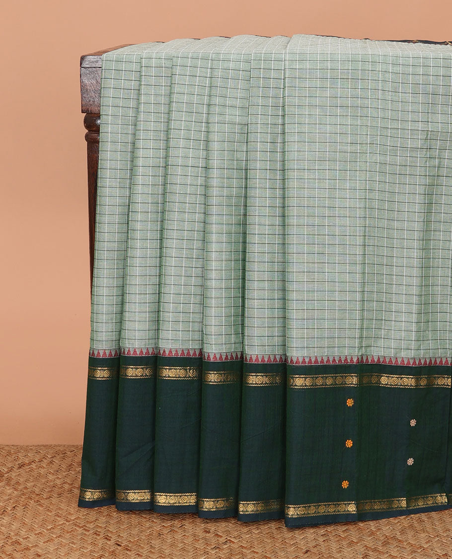 Green micro-checked Chettinad cotton saree, contrast thread and traditional zari border, and striped pallu