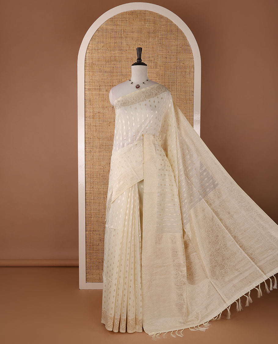 Cream banarasi jute saree with zari buttas, floral creeper zari border, floral jaal zari woven pallu & zari woven blouse