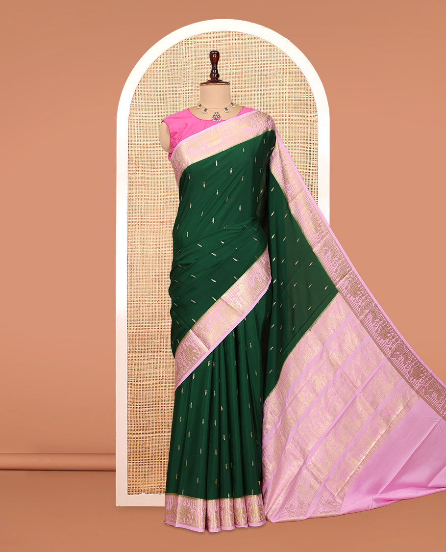 Green Mysore Silk Saree, Gleamed Up with Coin Zari Buttas, Complemented by a Contrast Traditional Zari Wedding Themed Border, a Rich Pallu, and Contrast Blouse