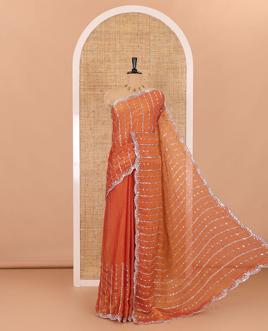 Orange vertical stripes embroidered shimmer chiffon saree, scallop embroidered border, embroidered pallu, and fancy embroidered matching blouse