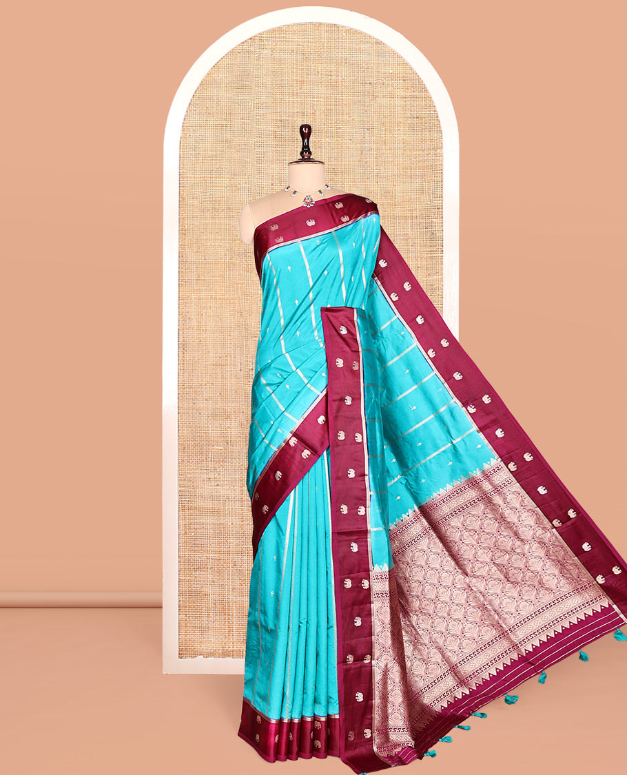 Blue Satin Silk Saree, Adorned with Buttas and Stripes, Complemented by a Contrast Elephant Motif Border, Grand Jaal Pallu, and a Contrast Blouse