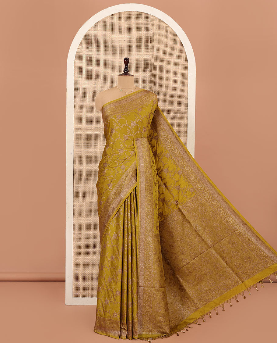 Green Mushru Silk Saree, Elegantly Woven with Floral Jaal Jacquard on Its Body, Sparsely Sparkled Zari Border, Mughal-Style Woven Pallu of Floral Bouquets, and Paired with a Matching Blouse