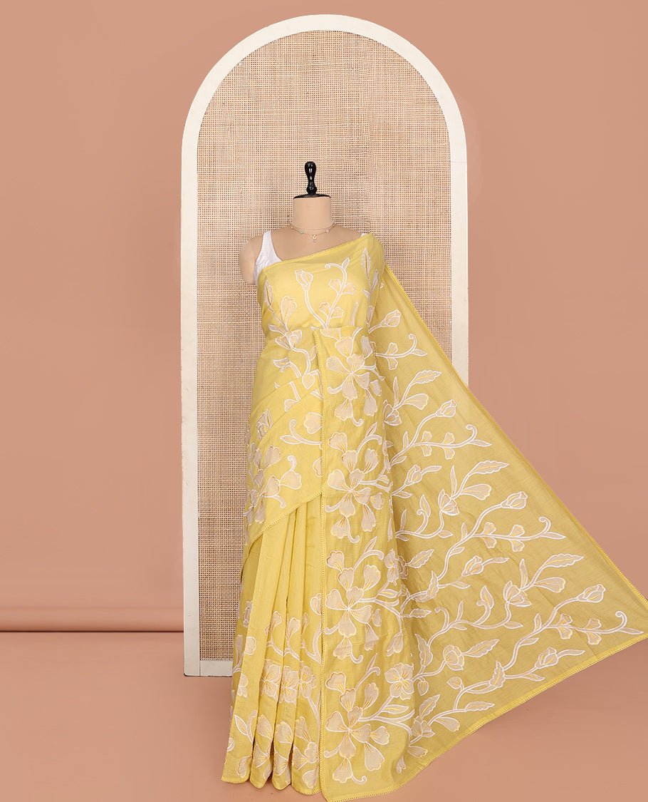 Yellow Fancy Tussar Saree, Artfully Detailed with Floral Vine Embroidery, a Subtle Scallop Border, and a Matching Blouse
