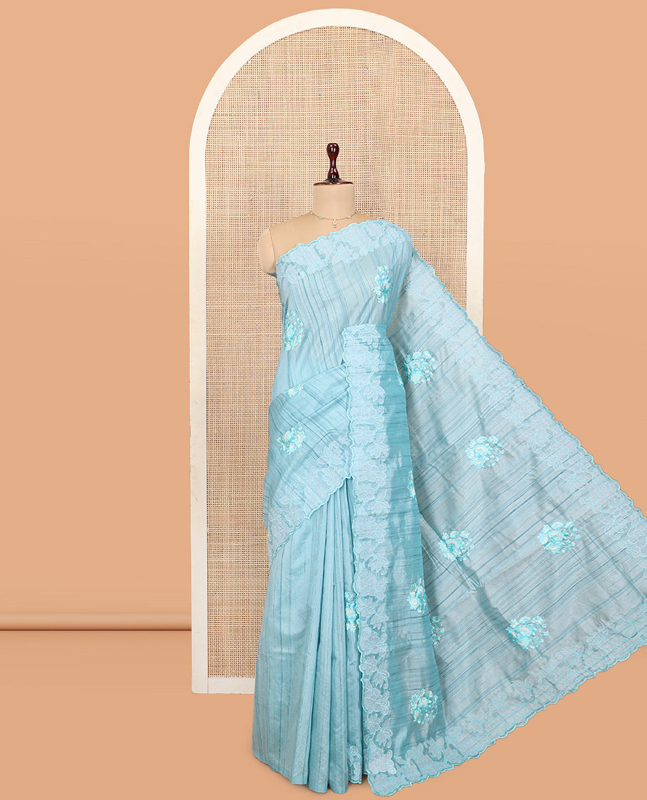 Blue Tussar Silk Saree Features Stripes and Floral Embroidery, a Scallop-Embroidered Border, and a Matching Blouse