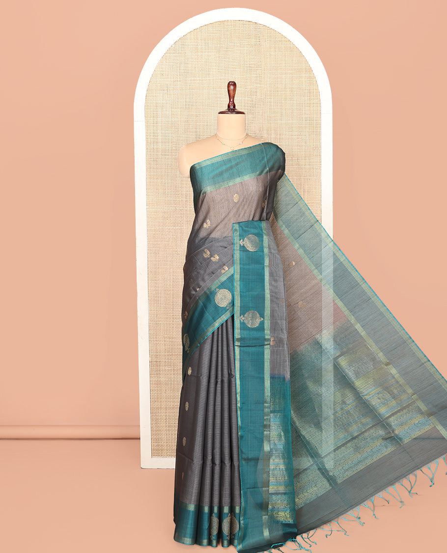 Grey Silk Cotton Saree, Adorned with Peacock and Rudraksha Buttas, Complemented by a Contrast Zari Buttas Border, Geometric Patterned Pallu, and a Contrast Blouse