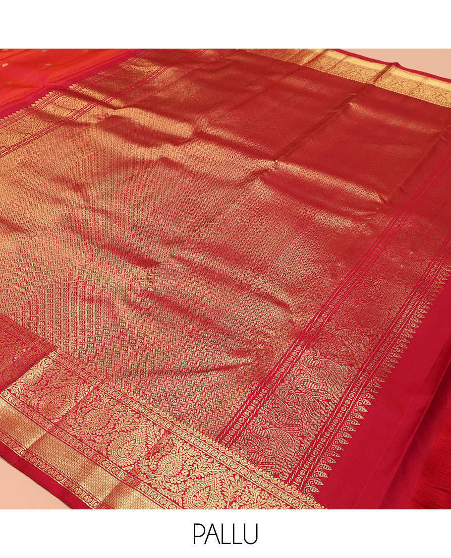 Orange Kanchipuram Silk Saree, Adorned with Zari Buttas All Over Its Body, Complemented by Contrast Border of Kamalam, Thilakam, and Mayil Kann Designs, Grand Jaal Pallu, and Paired with a Contrast Blouse