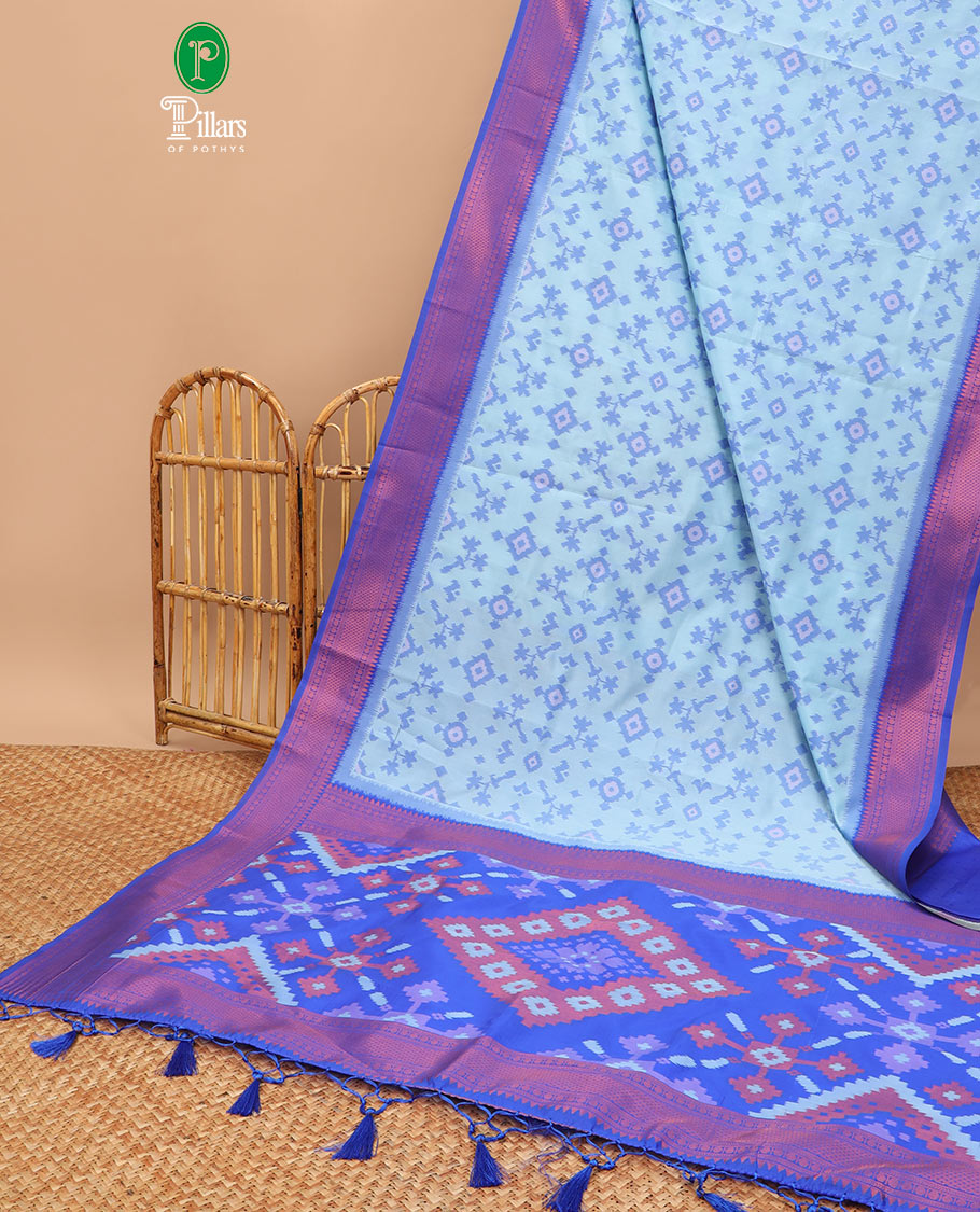 Sky blue ikkat design mulberry silk saree with contrast border & ikkat pallu along with self embosed butta blouse