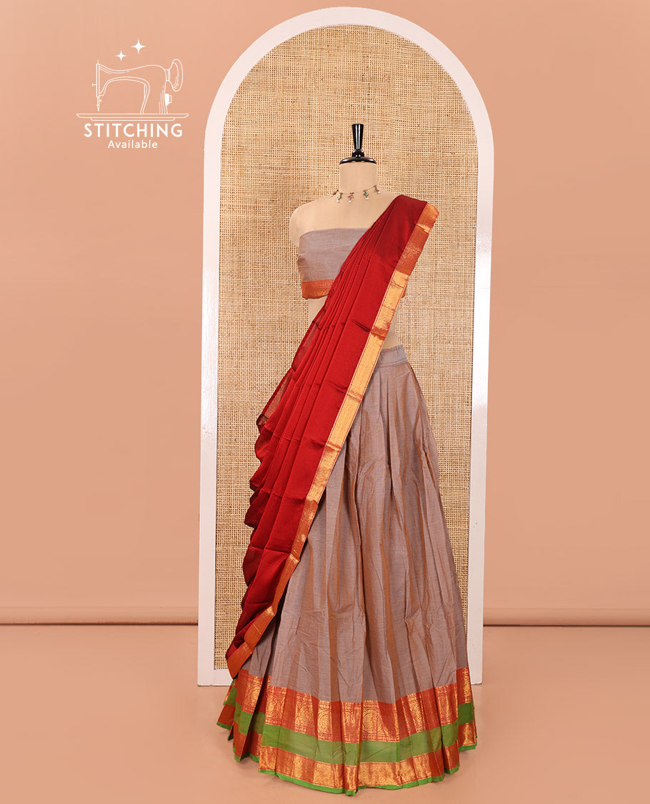 Grey Chettinad Cotton Half-Saree Featuring Plain Skirt, Complemented by Contrast Rettai Pettu Border of Round Peacock and Peacock Eye Designs, Paired with a Matching Blouse, and a Satin Georgette Zari Bordered Dhavani
